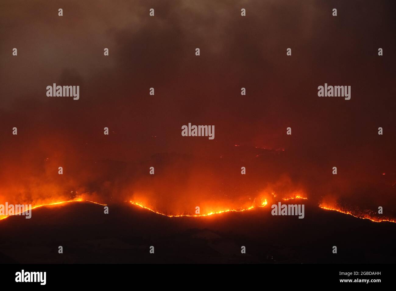 Large bushfire in the countryside of the province of Enna near the city of Aidone in Sicily on 2021 Stock Photo