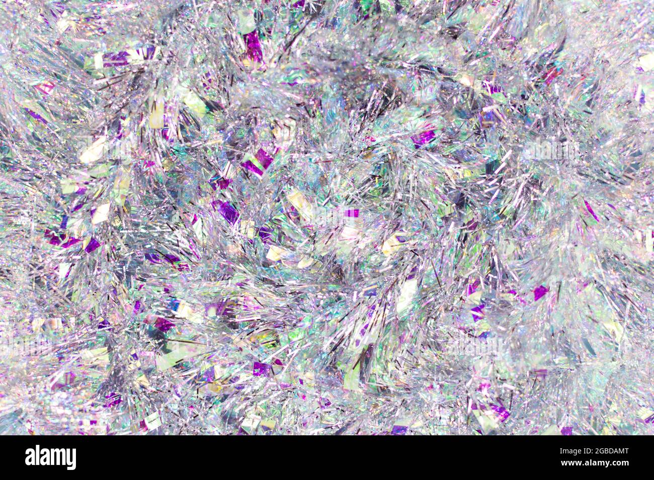 Christmas background with tinsel. Silvery background and beautiful bokeh. Stock Photo