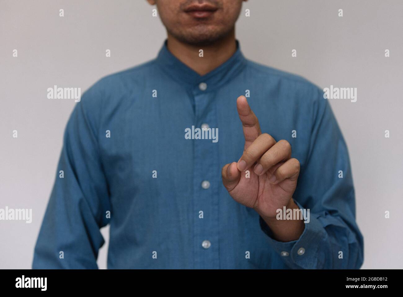 Man wearing light blue shirt hi-res stock photography and images - Alamy
