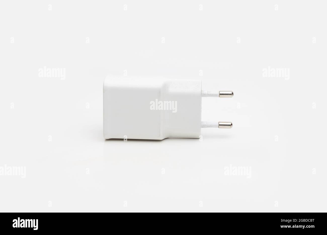 Used usb smartphone charger on isolated white background Stock Photo