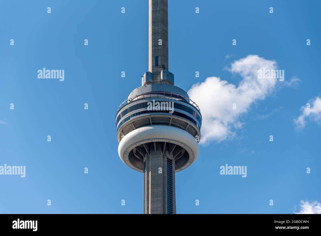 The CN Tower on a summer blue sky day. The Canadian National Tower is a telecommunications facility, major tourist attraction, and a  symbol of Canada Stock Photo