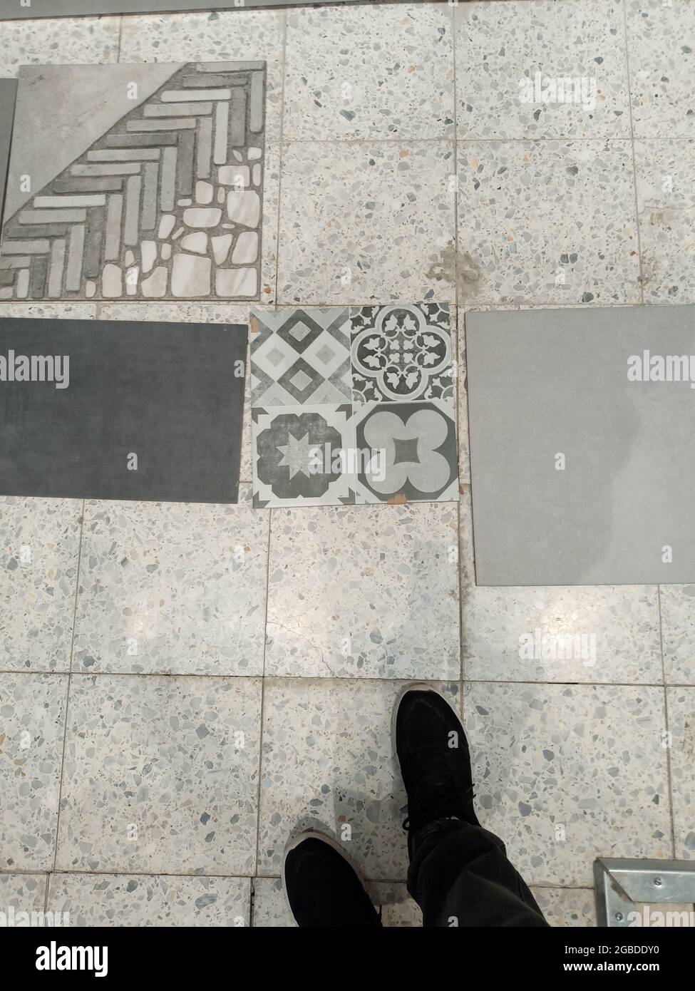 Various floor tiles offered to customers in the building materials company. Stock Photo