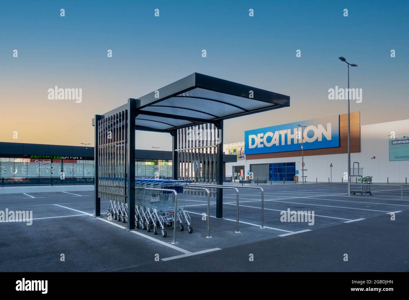 MADRID, SPAIN - JULY 16, 2021: Shopping carts in a shopping park, close to Decathlon shop Stock Photo