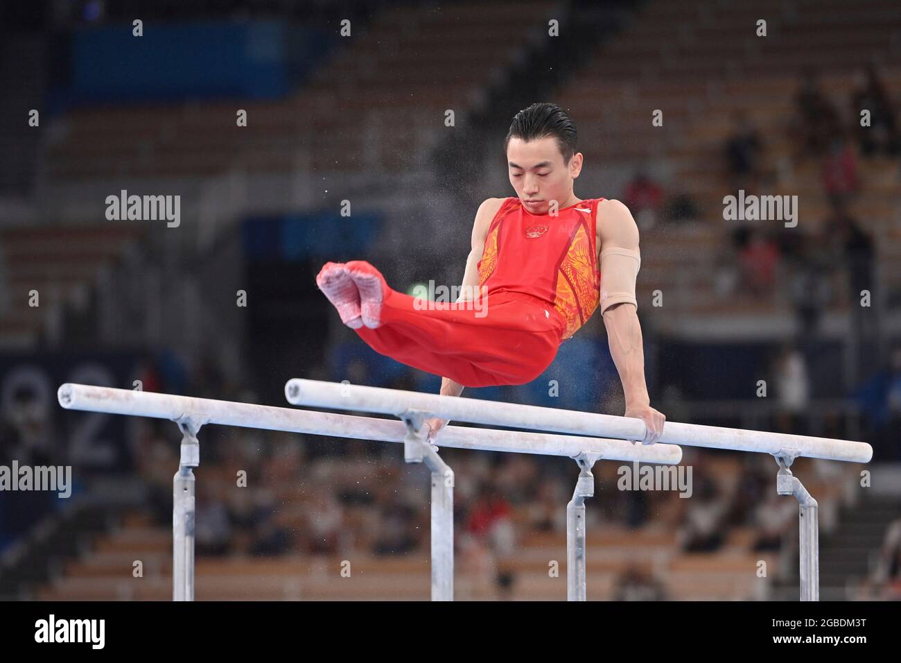 Tokyo, Japan. 03rd Aug, 2021. Jingyuan ZOU (CHN), action, winner, winner, Olympic champion, 1st place, gold medal, gold medalist, Olympic champion, gold medalist Artistic Gymnastics, gymnastics, apparatus final of men, apparatus final, parallel bars menÕs parallel bars, on 03.08.2021 Ariake Gymnastics Center. Olympic Summer Games 2020, from 23.07. - 08.08.2021 in Tokyo/Japan. Credit: dpa/Alamy Live News Stock Photo