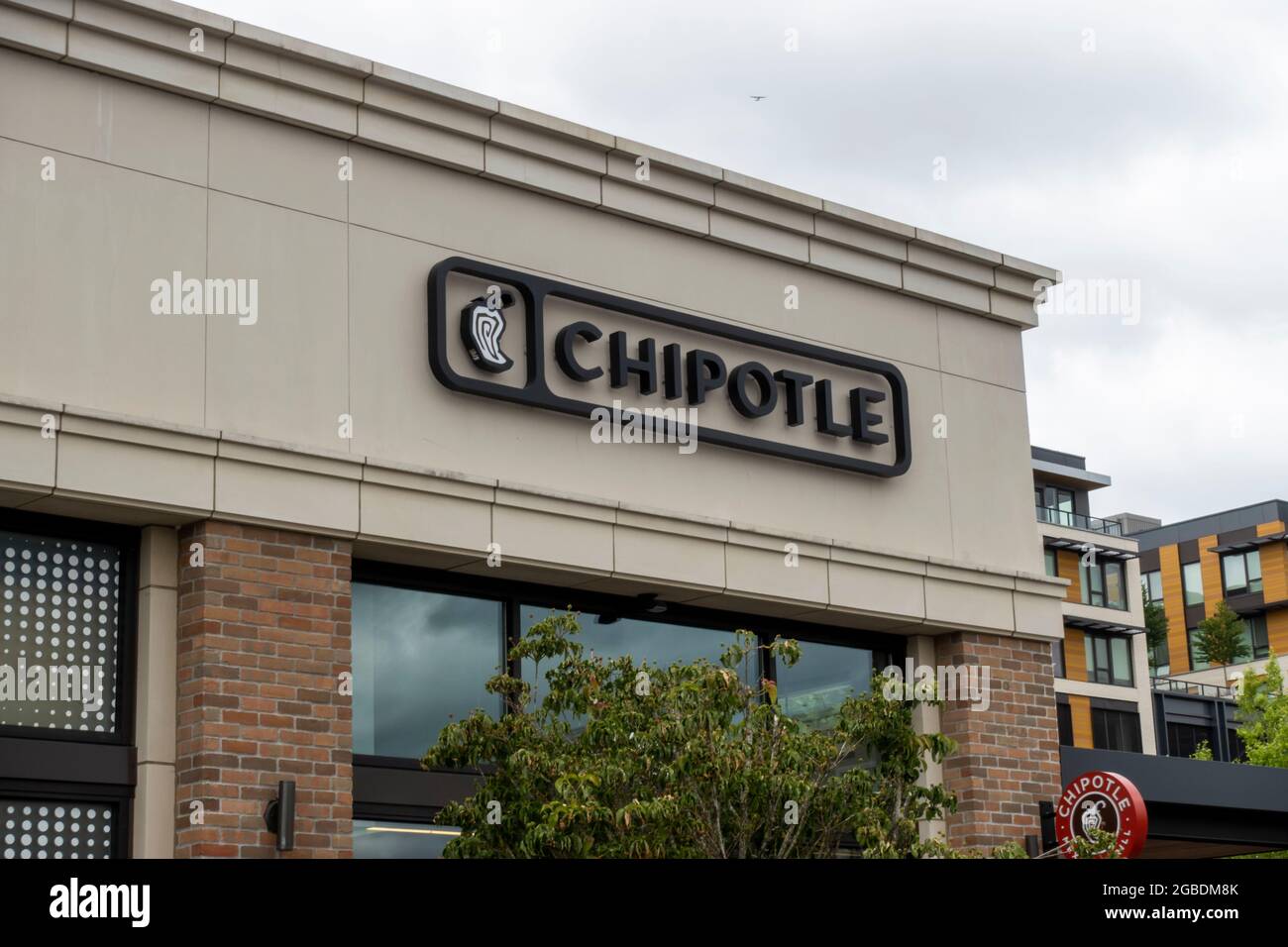 Kirkland, WA USA - circa July 2021: Low angle view of a Chipotle Mexican fast casual food establishment Stock Photo