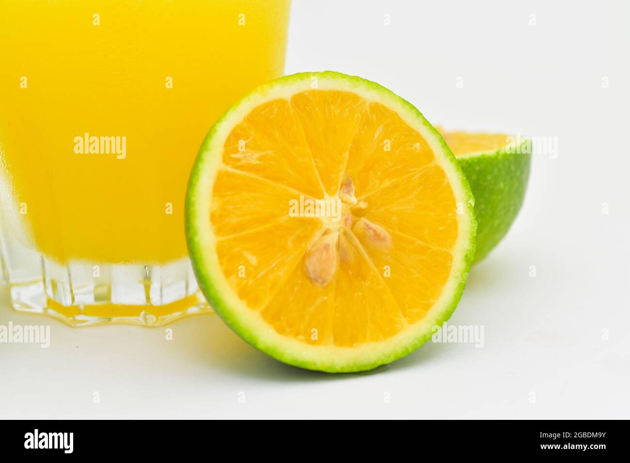 Lemonade with a lemon isolated on white Stock Photo