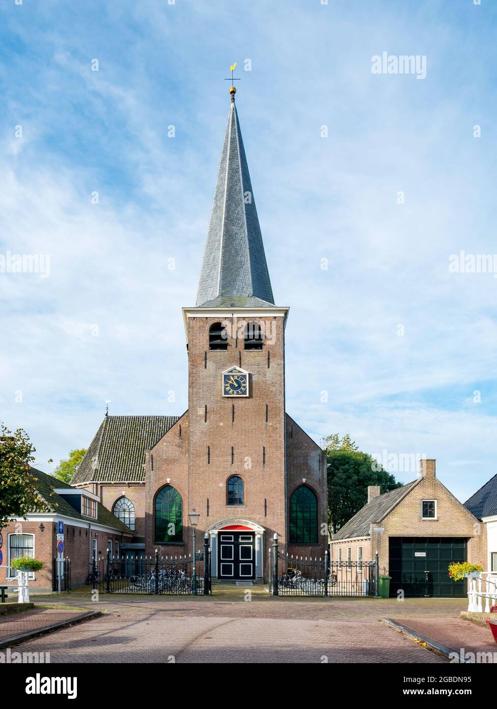 Building of Mauritiuskerk, church with tower in city of IJlst, Friesland, Netherlands Stock Photo