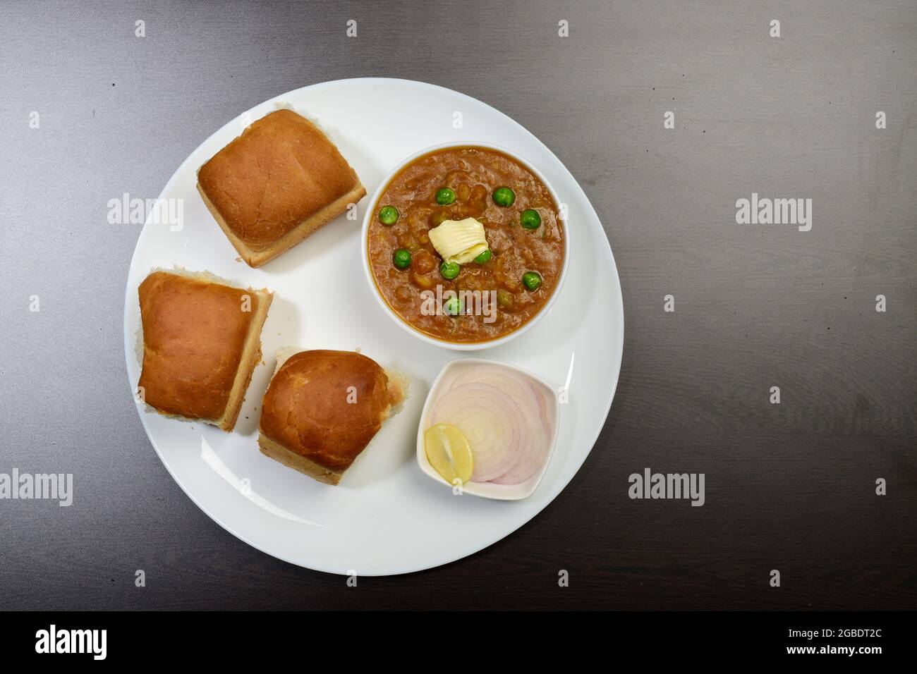 Top view Of Pav Bhaji With Onion Lemon In Plate, Indian Famous Snack Stock Photo