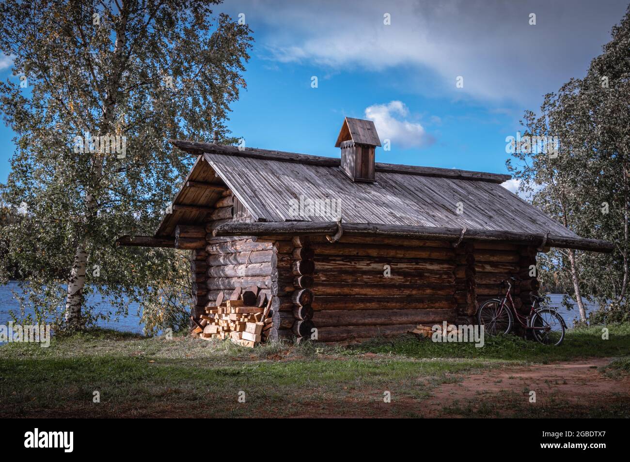 Ancient wooden house on the bank of the Svir river. Mandrogi Village, Russia. Stock Photo