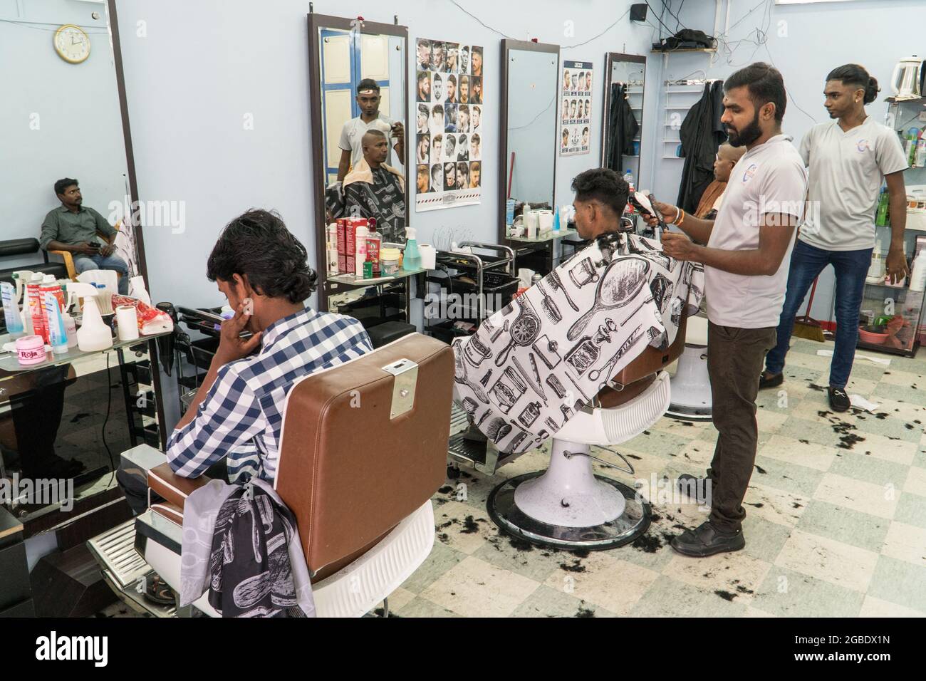 Singapore -january 28th 2019: Men barber in a barbershop making hairdress  in Indian quarter in Singapore Stock Photo - Alamy
