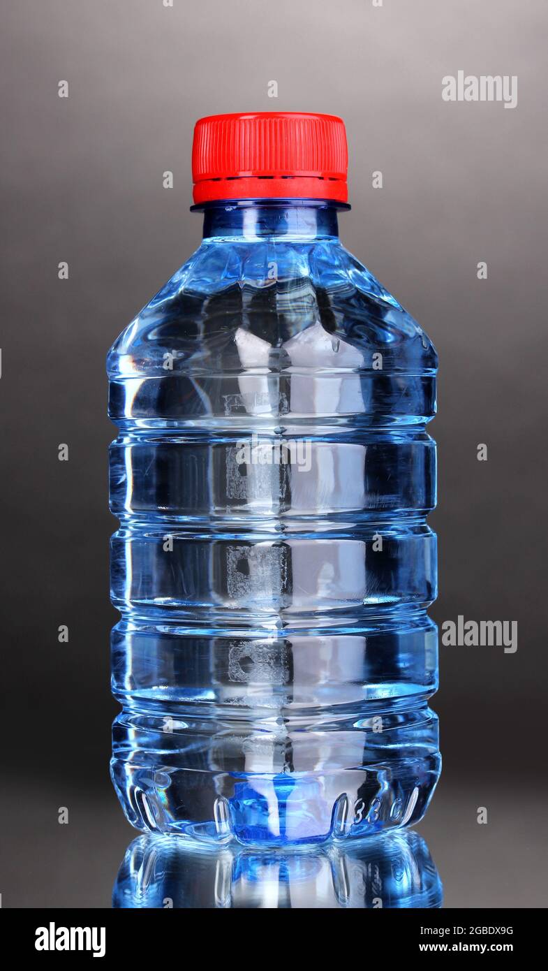 plastic bottle of water on grey background Stock Photo Alamy
