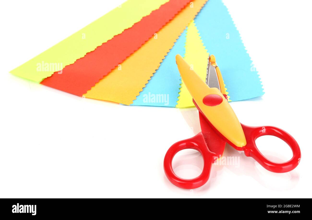 Colorful zigzag scissors with color paper isolated on white Stock Photo