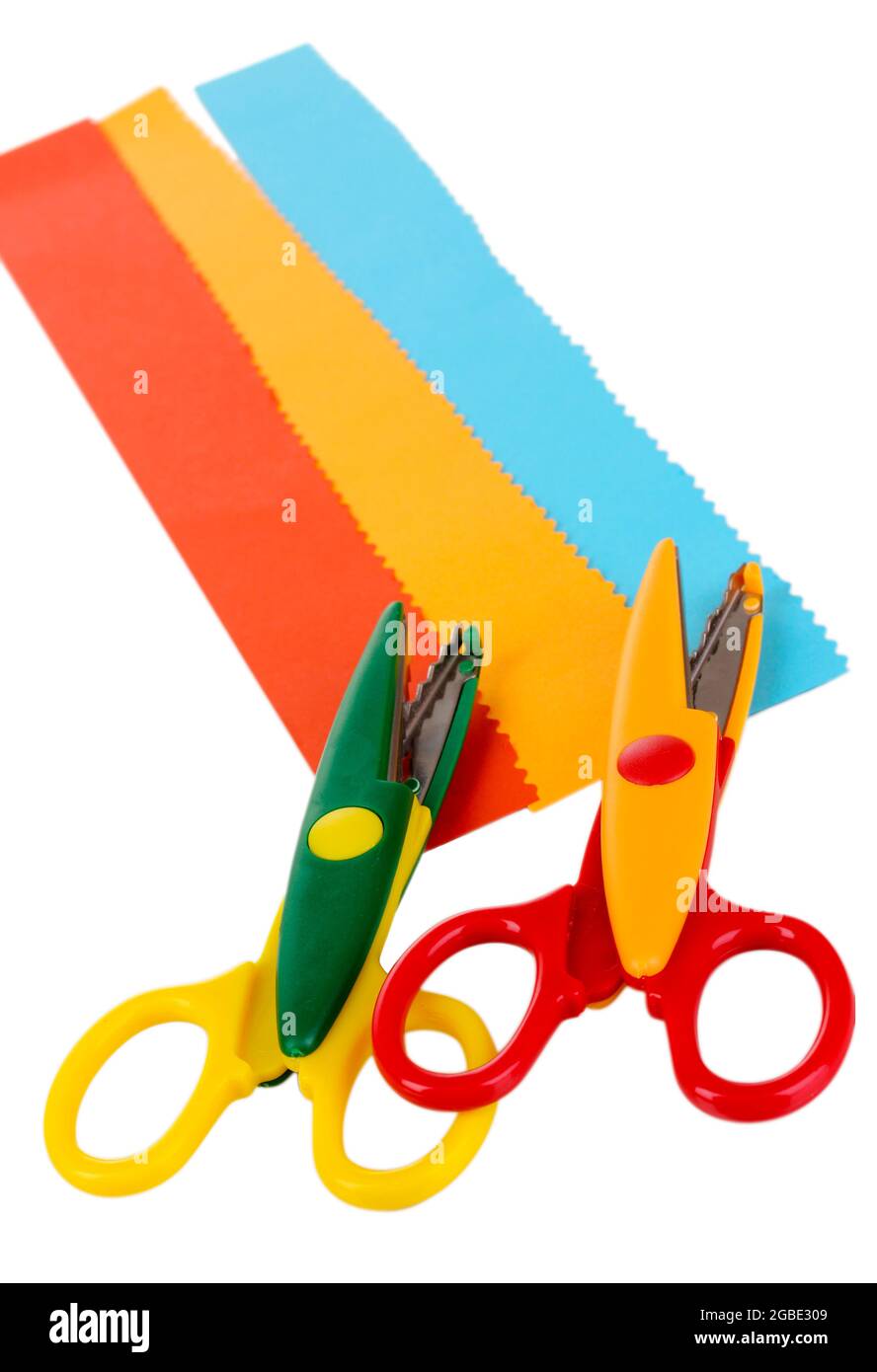 Colorful zigzag scissors with paper strips isolated on white Stock