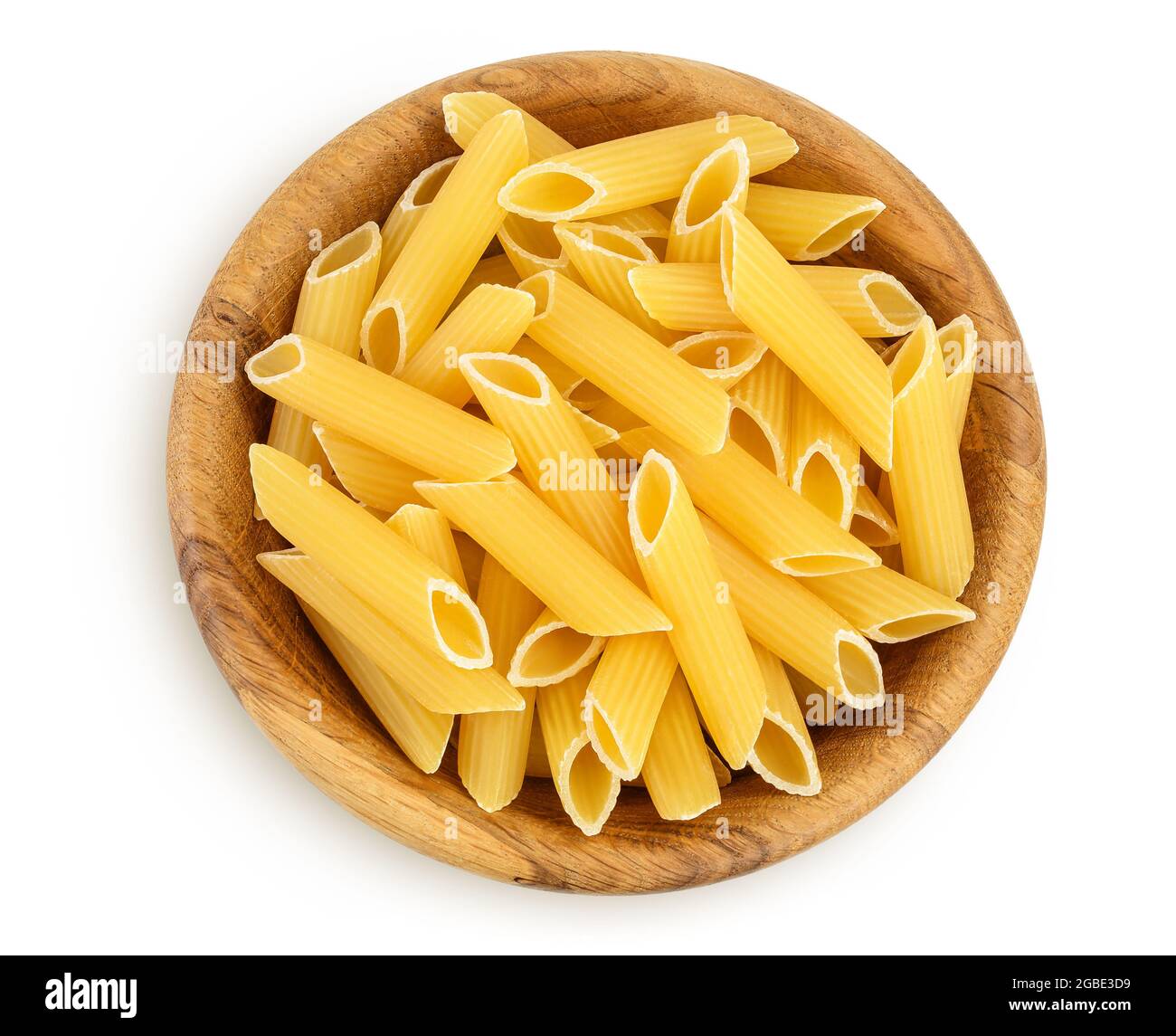 Raw italian penne rigate pasta in wooden bowl isolated on white background with clipping path and full depth of field. Top view. Flat lay Stock Photo