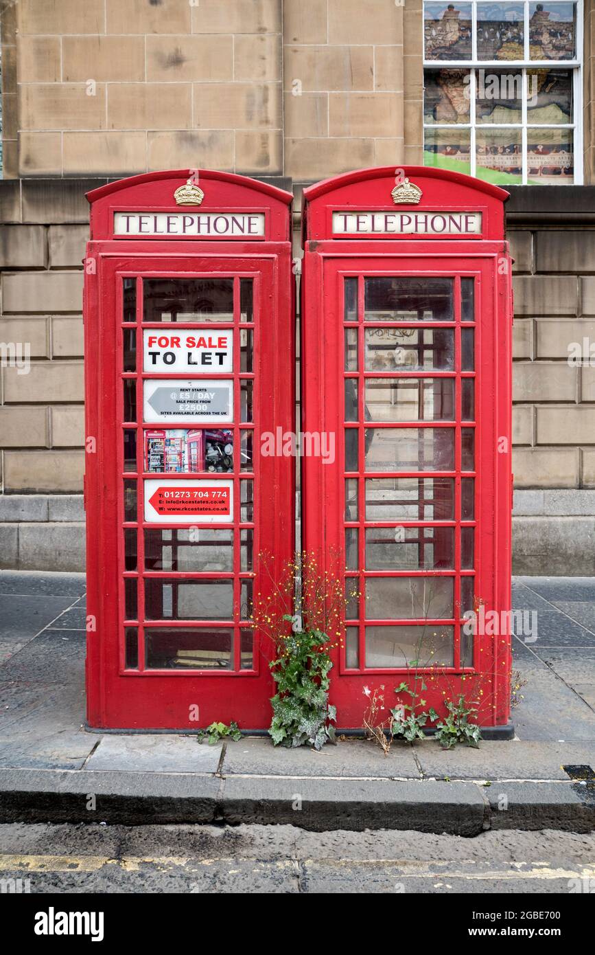 Red telephone boxes 'To Let' on George IV Bridge in Edinburgh's Old Town. Stock Photo