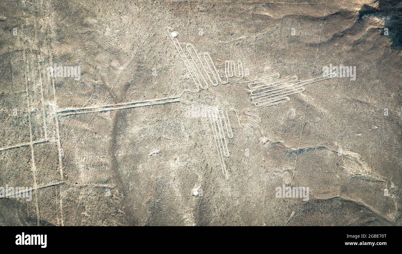 The Hummingbird Nazca ancient mysterious geoglyph. Nazca lines as seen from the aircraft. Nazca lines are landmarks of Peru Stock Photo