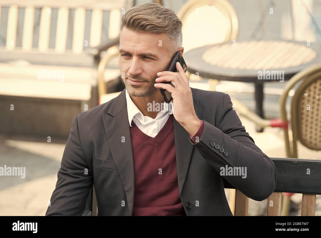 Youre never alone with cellphone. Businessman make phone call outdoors ...