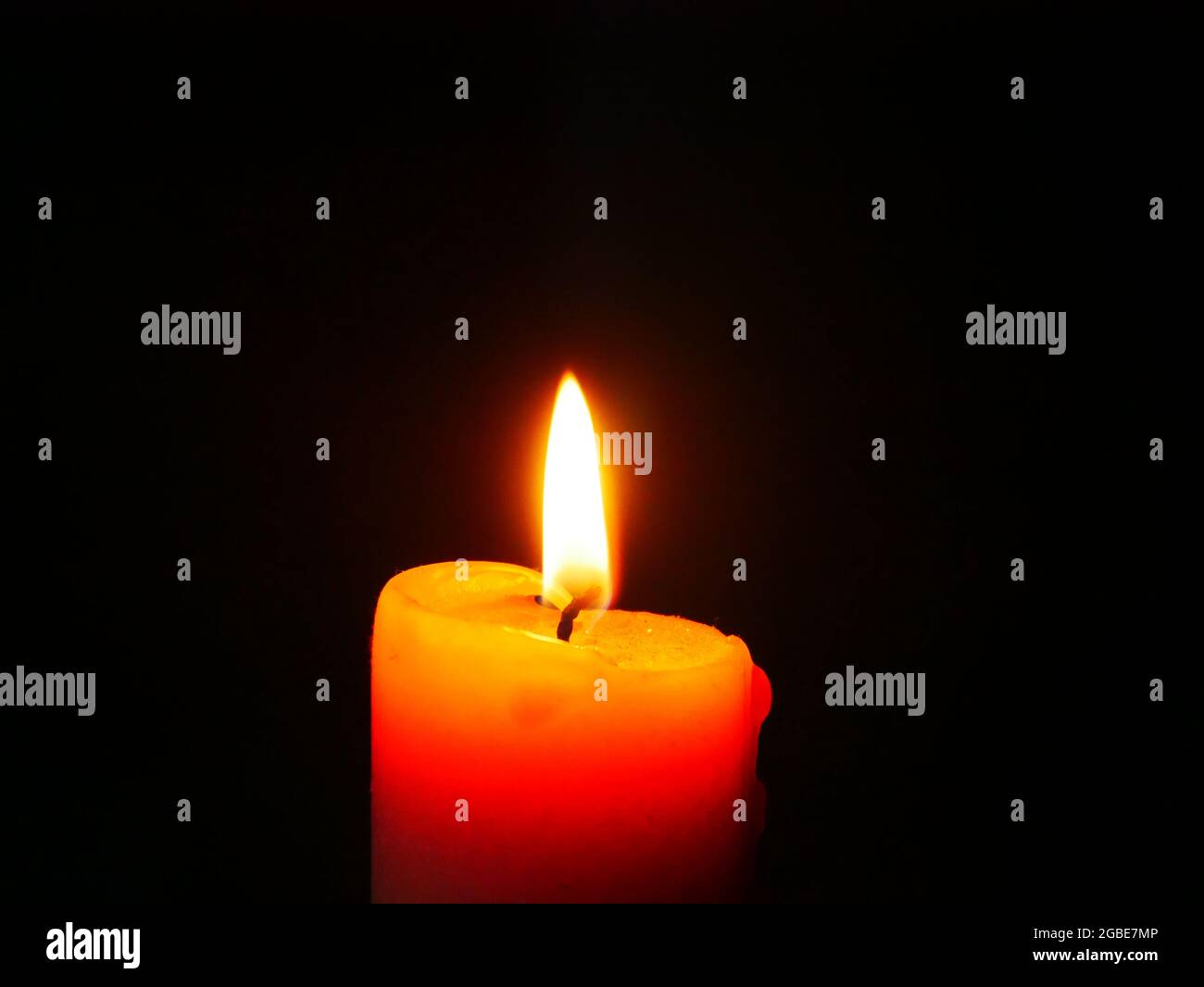 Burning candle on a black background with free space for text Stock ...