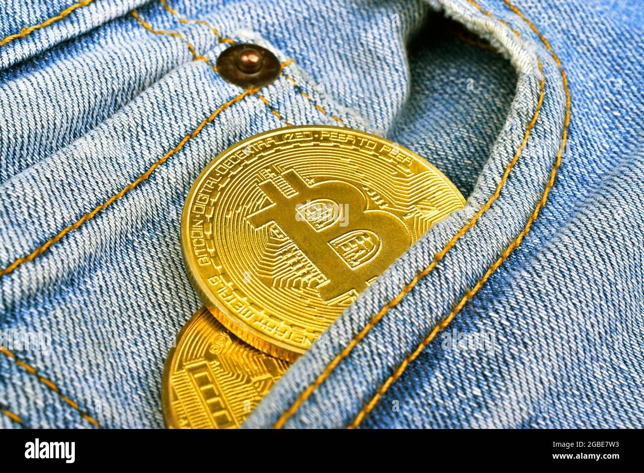 Bitcoin in jeans pocket Stock Photo - Alamy