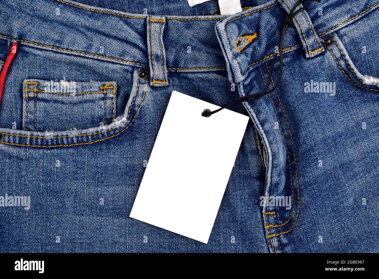 Blank Price Tag On Denim Jeans Stock Photo - Alamy