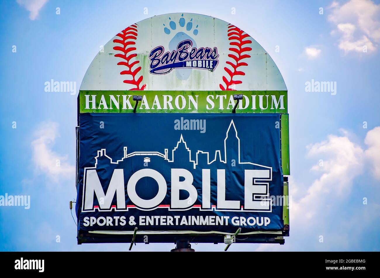 The Hank Aaron Stadium sign is partially covered by a sign from Mobile Sports & Entertainment Group, Aug. 1, 2021, in Mobile, Alabama. Stock Photo