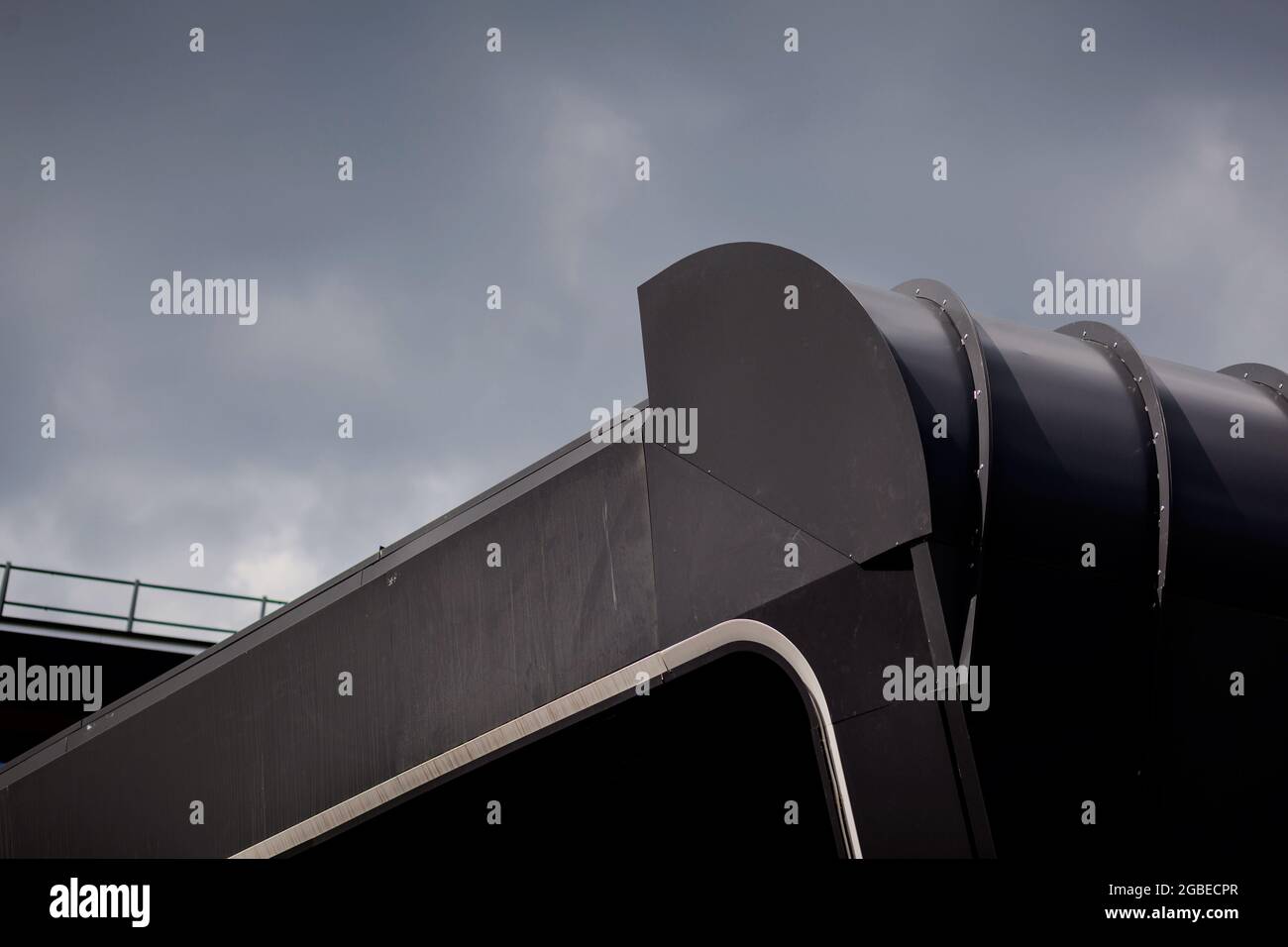 Metal sheet building with clouds sky. modern architecture Stock Photo