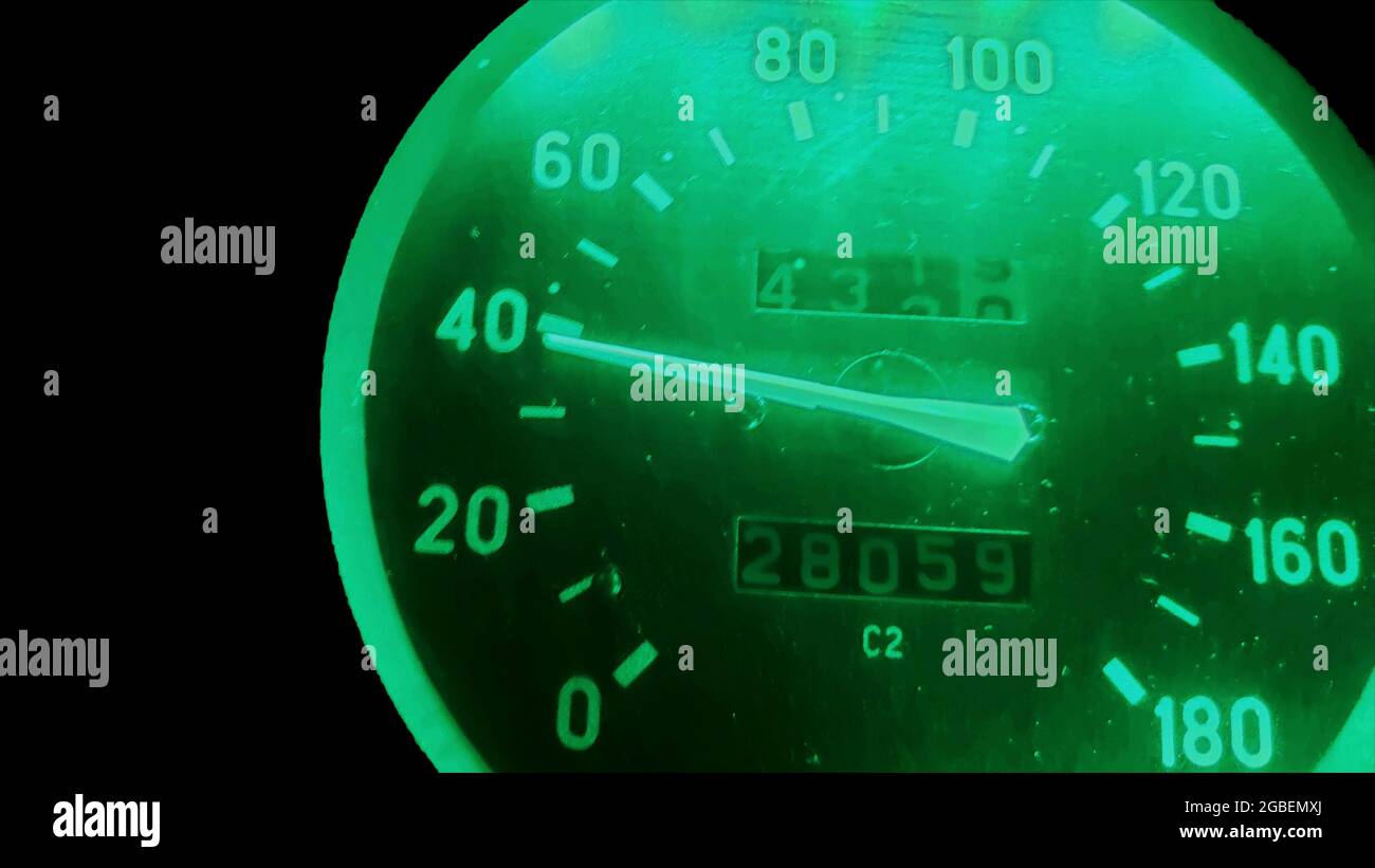 speed on the speedometer with green backlight. Stock Photo