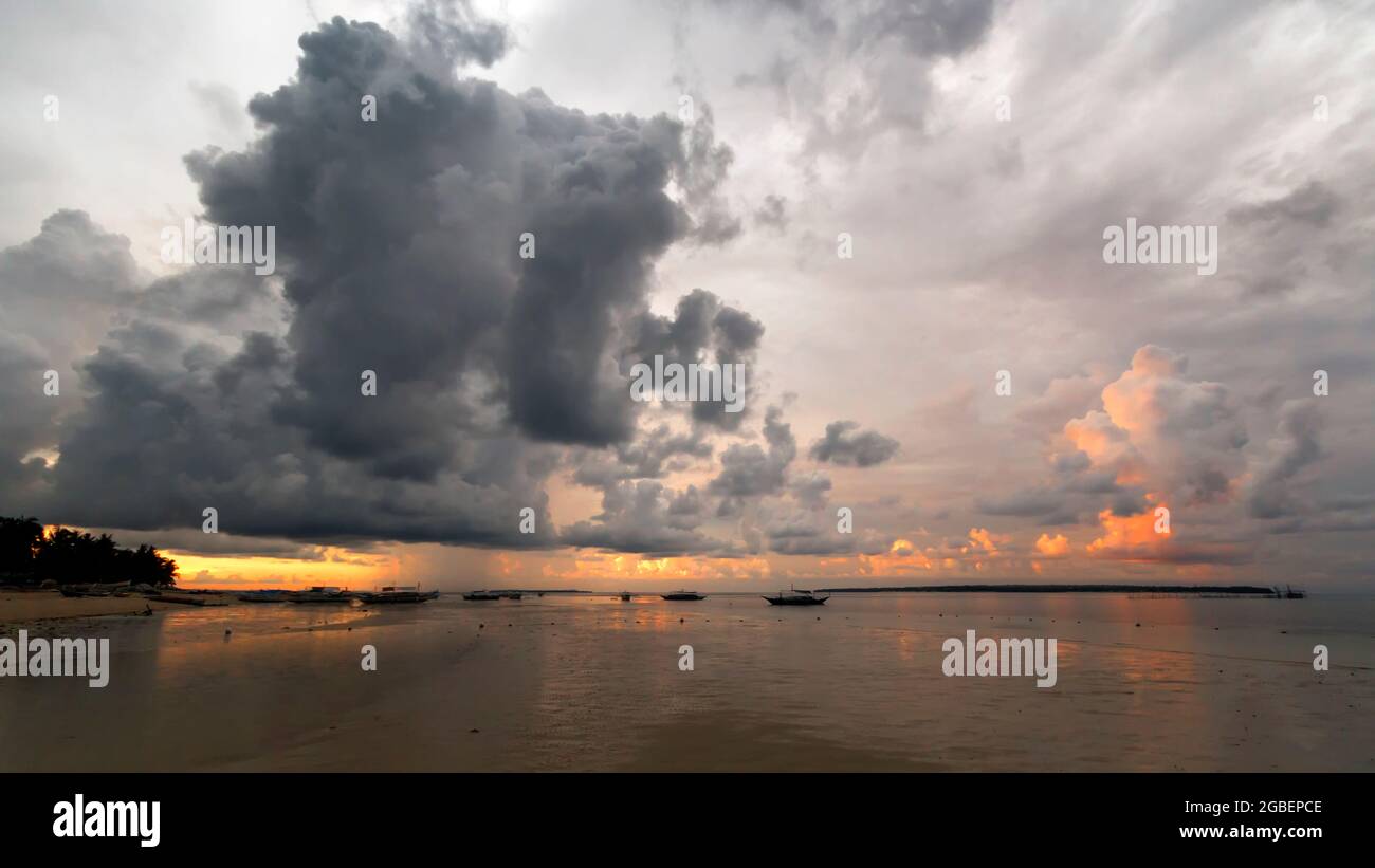 clouds in the sky over a body of water Stock Photo - Alamy