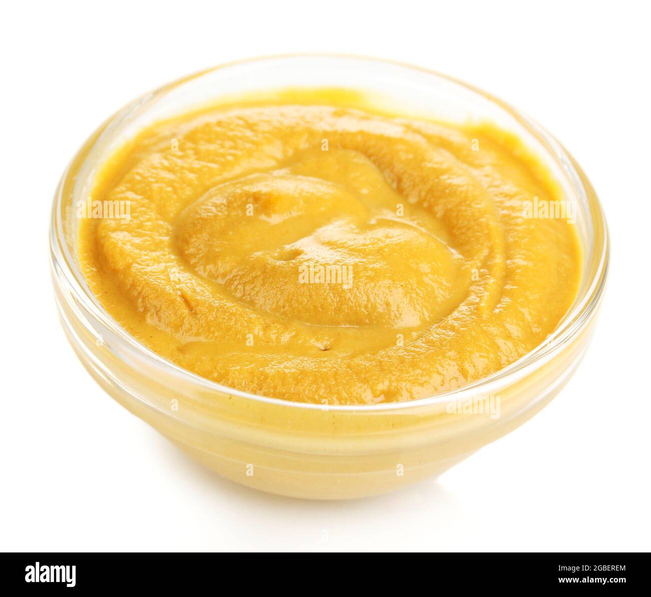 Mustard in glass bowl isolated on white Stock Photo Alamy