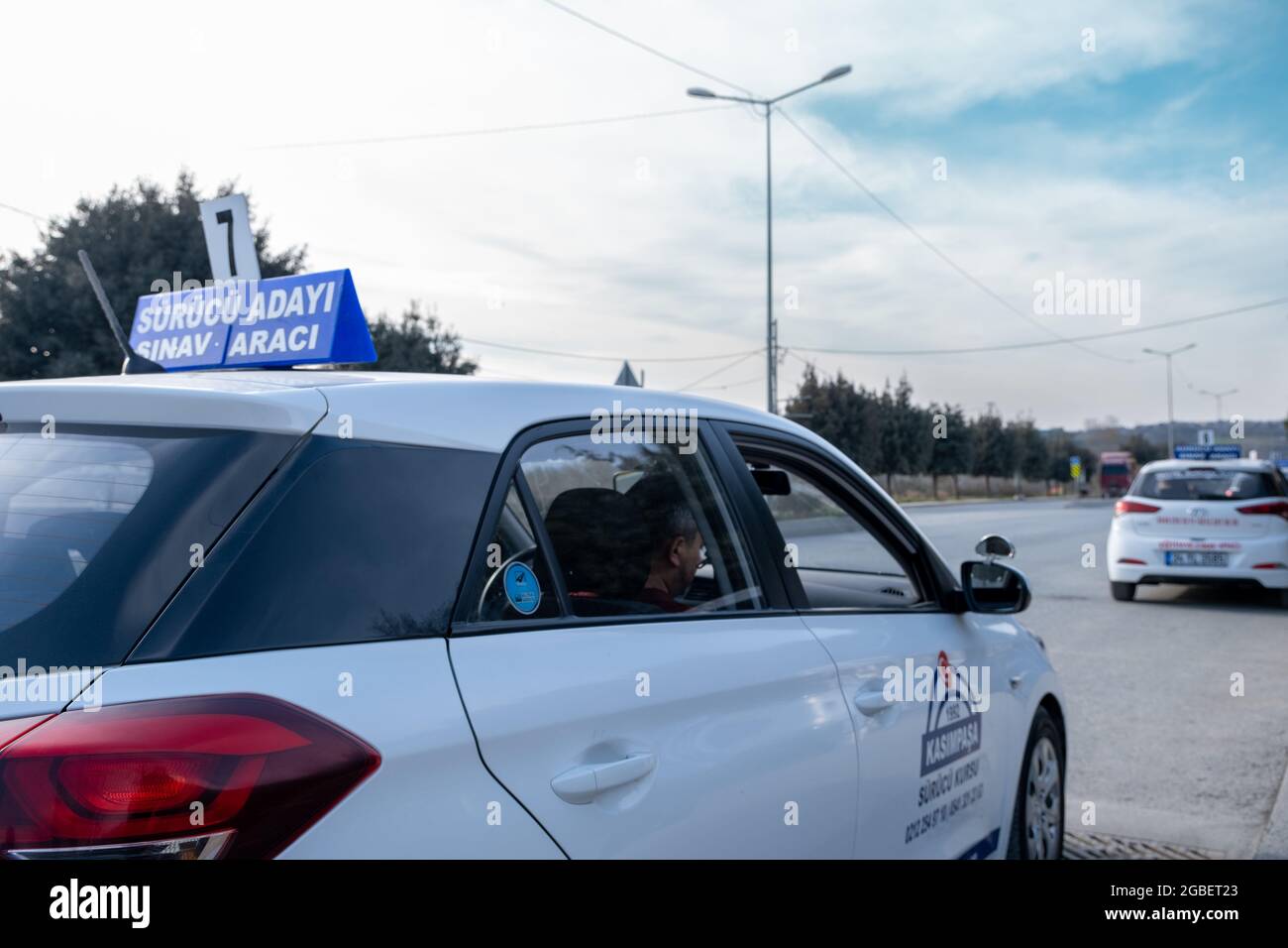 Kemerburgaz, Istanbul, Turkey - 02.18.2021: close up of a driving test car which is about to move and out of focus foreground. Translation of signboar Stock Photo