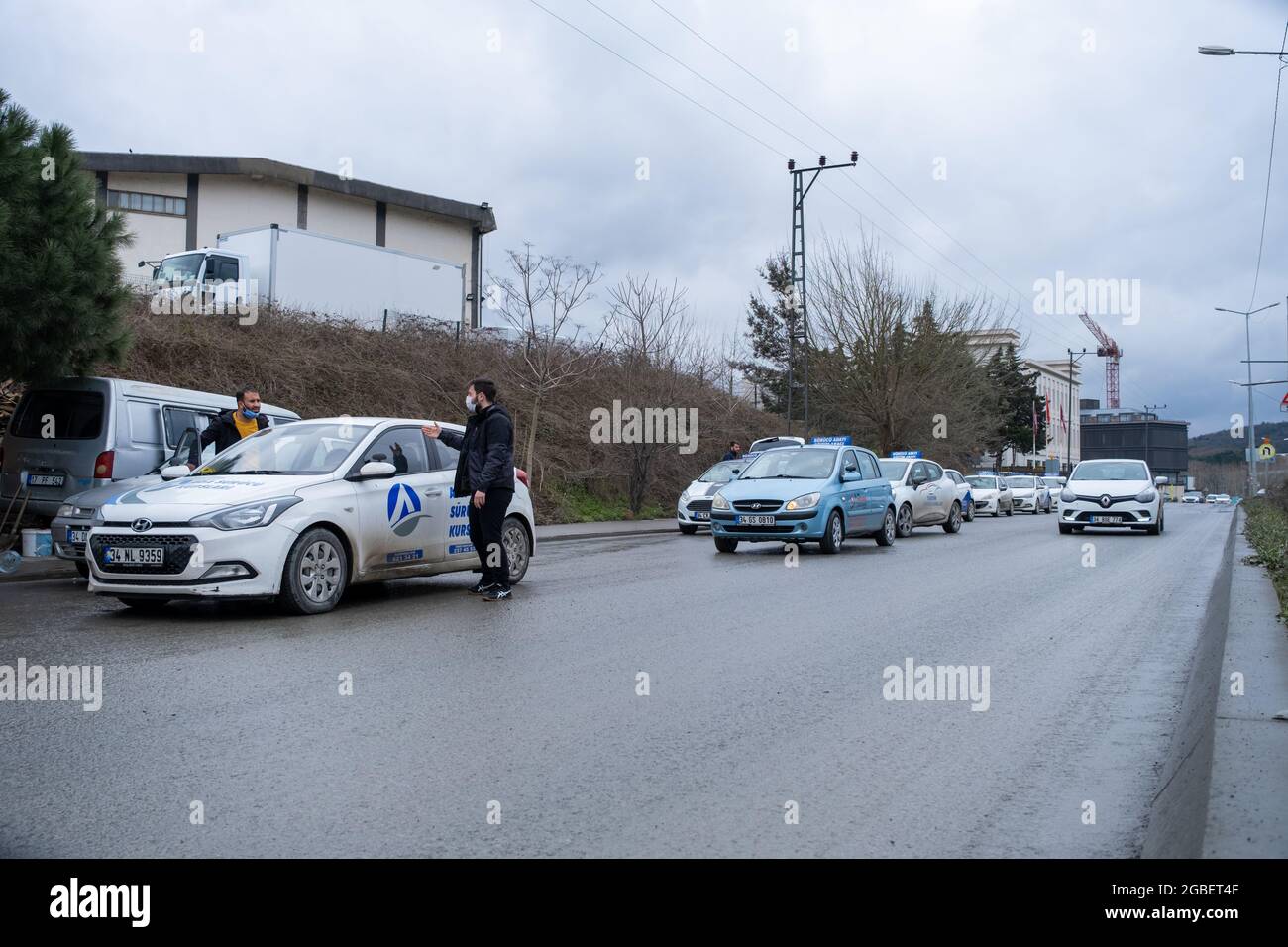 Kemerburgaz, Istanbul, Turkey - 02.25.2021: driving school cars and learner drivers before test day in winter time with copy space. Translation of sig Stock Photo