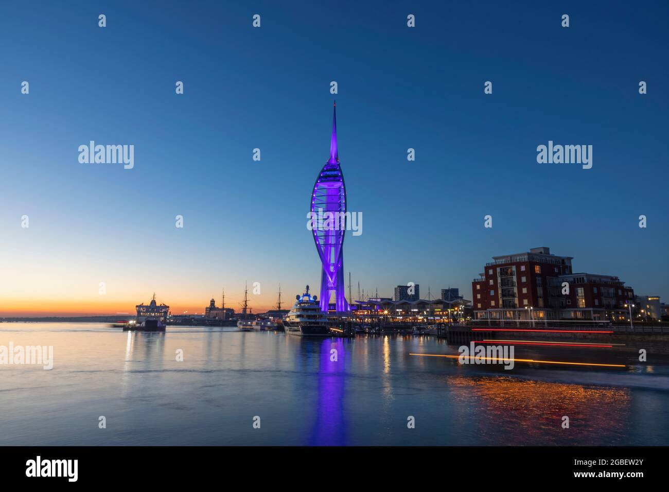England, Hampshire, Portsmouth, Spinnaker Tower and City Skyline Illuminated at Night Stock Photo