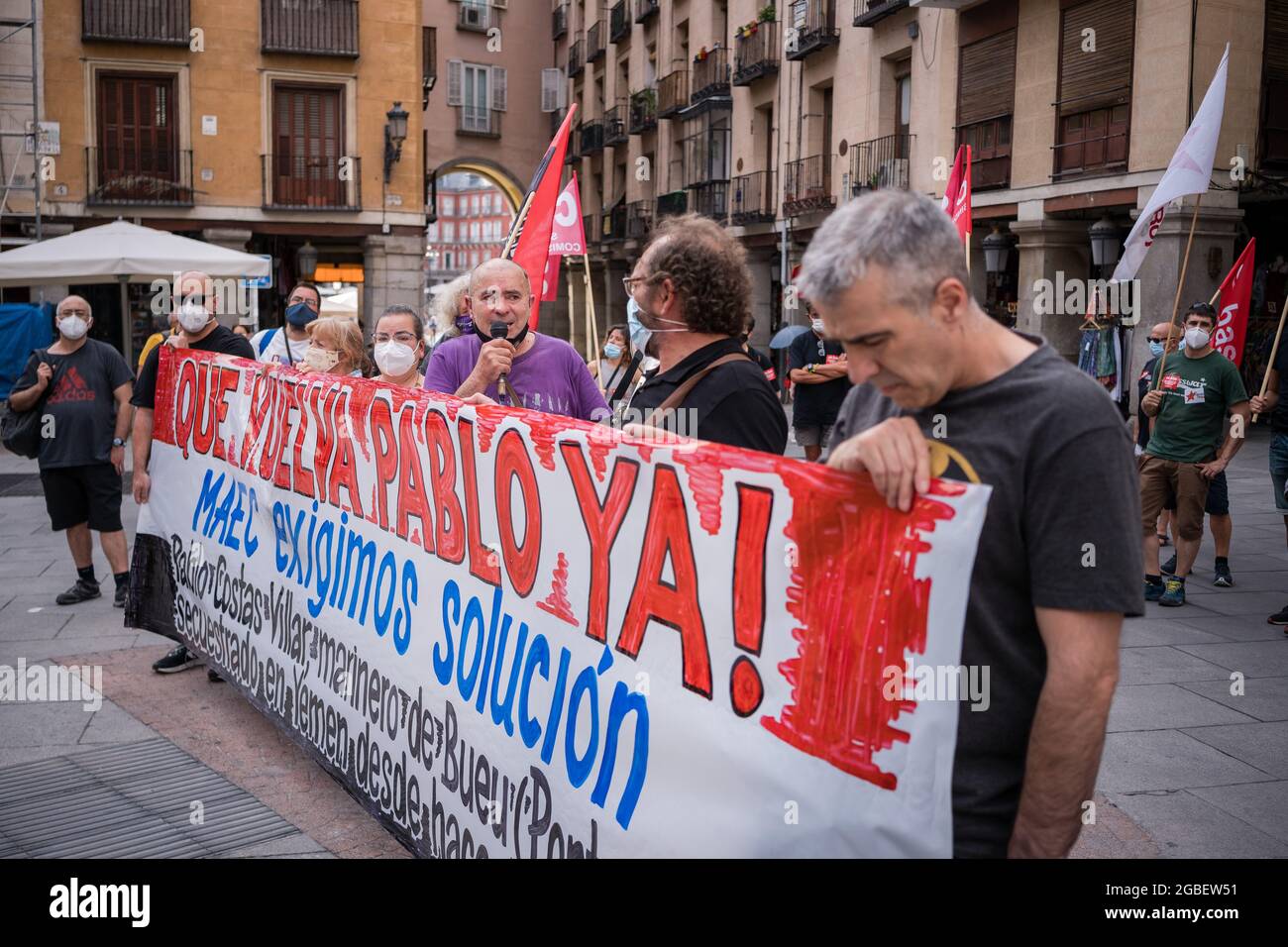 Madrid, Spain. 03rd Aug, 2021. Protesters seen behind a huge banner calling for the release of Pablo Costa during the demonstration.Workers' unions protest in front of the Ministry of Foreign Affairs of Spain demanding government's attention in the case of Pablo Costas Villar, the captain of the fishing boat 'Cobija', who has been detained for more than 10 months on the maritime coasts of Yemen. (Photo by Diego Radames/SOPA Images/Sipa USA) Credit: Sipa USA/Alamy Live News Stock Photo
