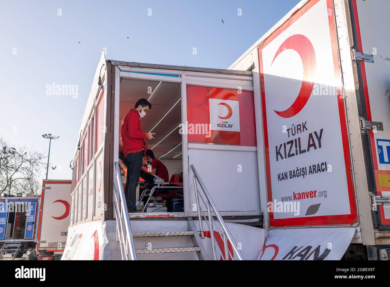 Eminonu, Istanbul, Turkey - 02.26.2021: employee of Turkish Red Crescent on duty. Translation on table of car: Turkish Red Crescent Blood Donation Veh Stock Photo