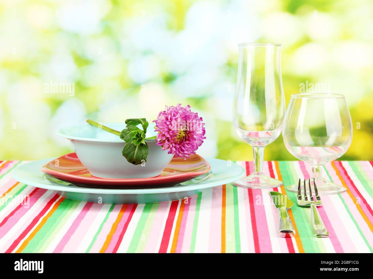 Table setting on bright background close-up Stock Photo - Alamy