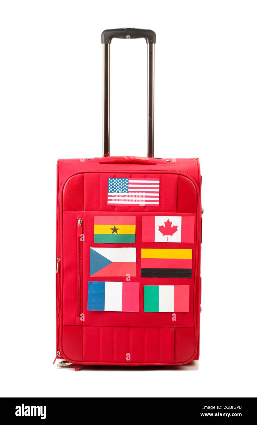 red suitcase with many stickers with flags of different countries