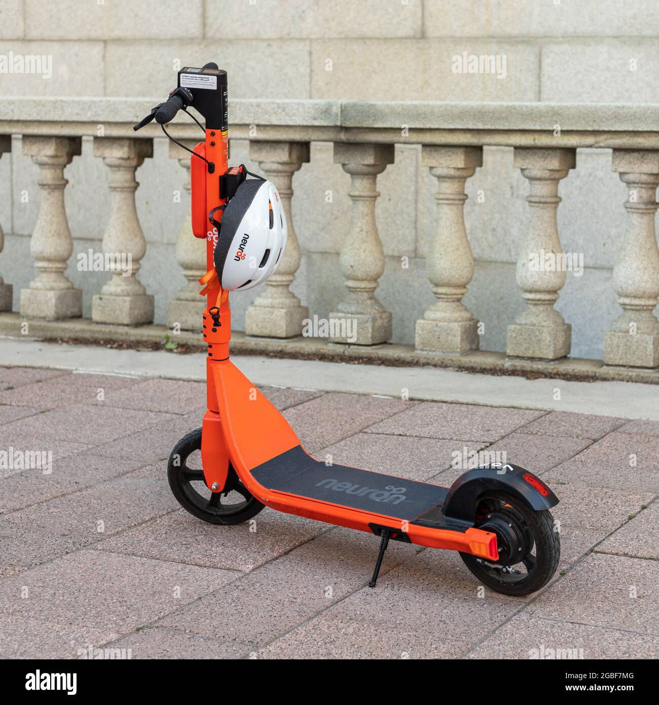 Ottawa, Canada - August 2, 2021: Electric scooter with helmet for rent on  the street. Orange E-scooter on the sidewalk in downtown Stock Photo - Alamy