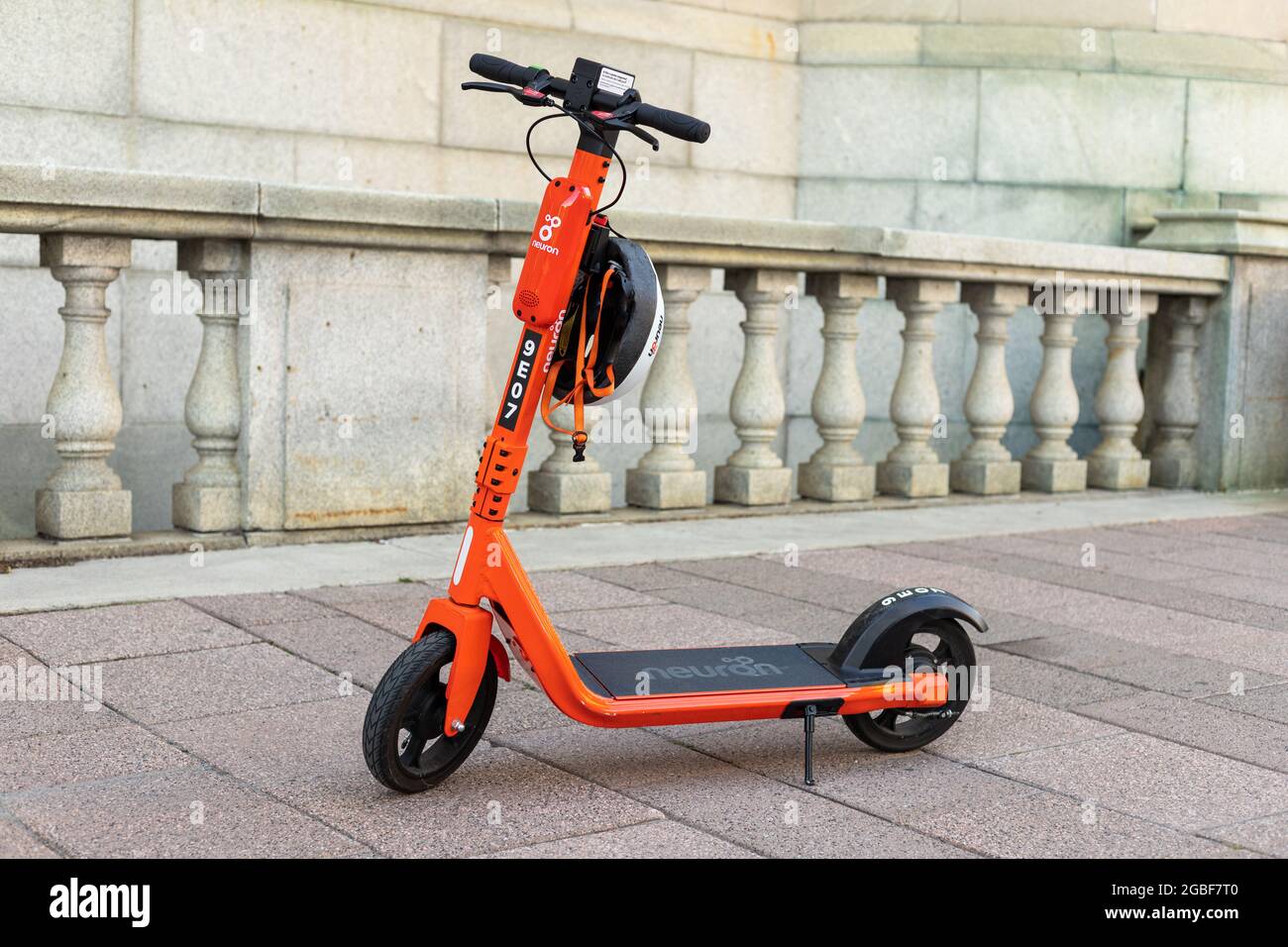 Ottawa, Canada - August 2, 2021: Electric scooter with helmet for rent on  the street. E-scooter parked on the sidewalk in downtown Stock Photo - Alamy
