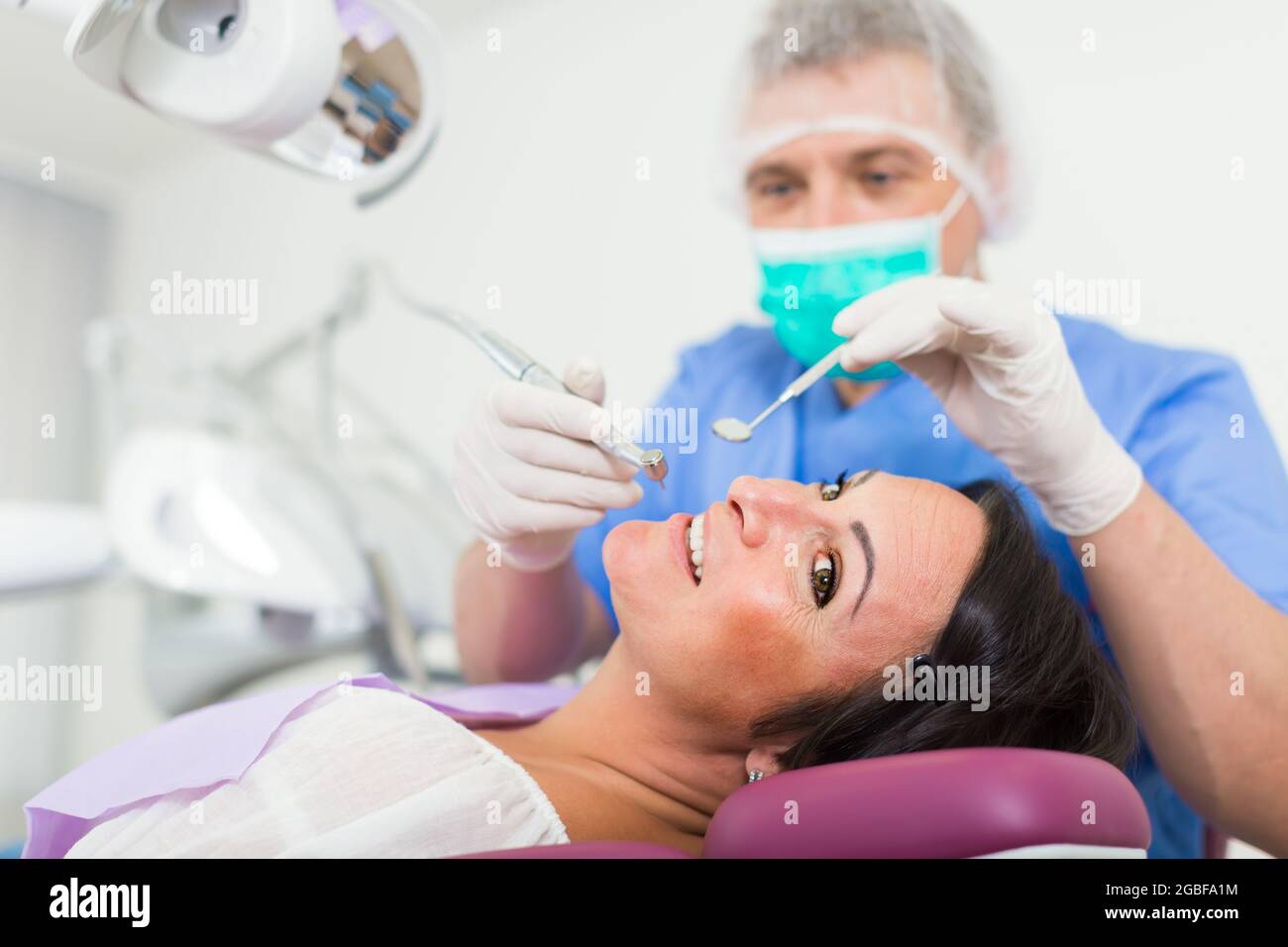 dentist professional filling teeth Stock Photo Alamy