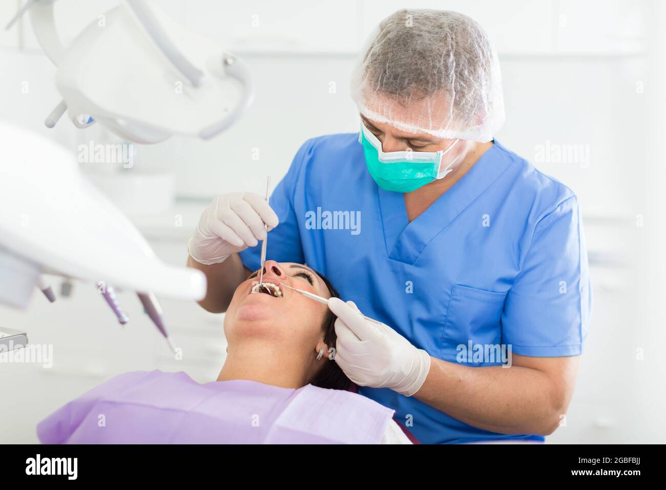 adult dentist checking teeth Stock Photo Alamy