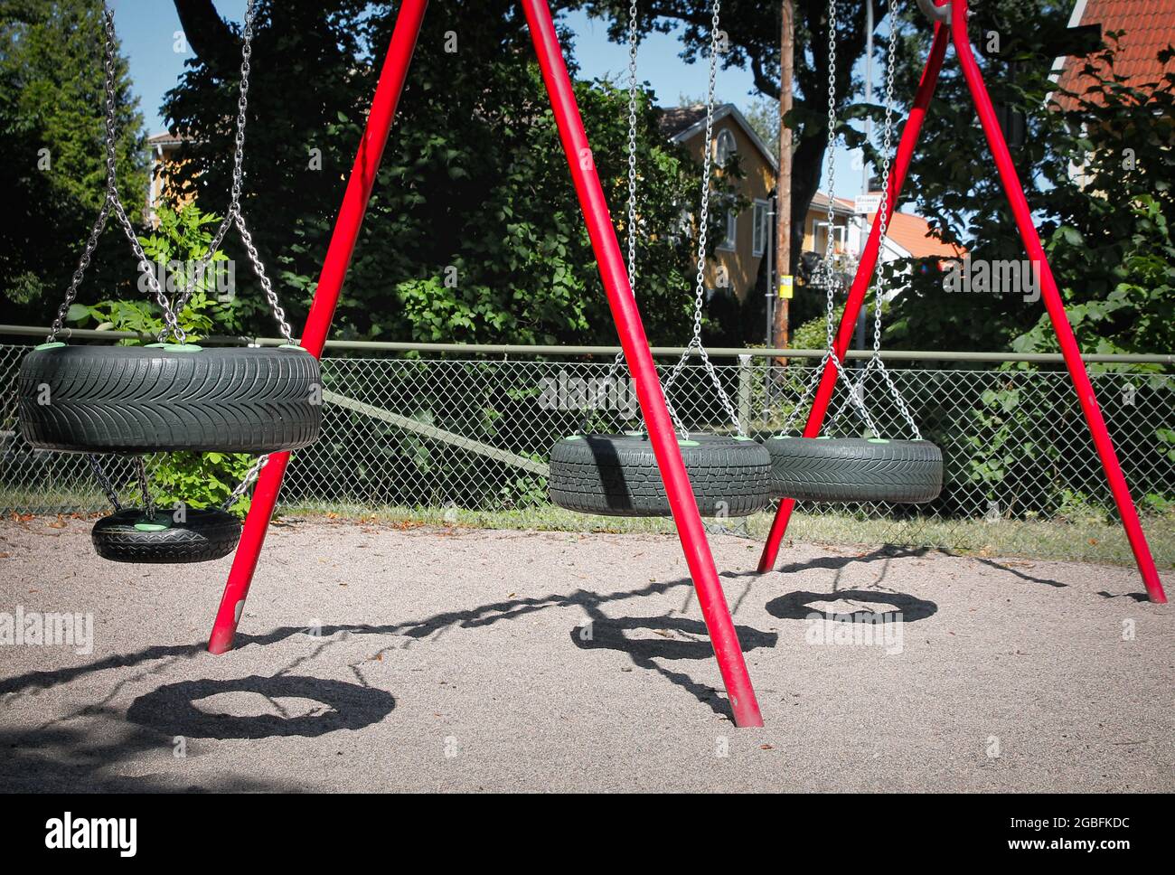 Swing made with car tires in the playground Stock Photo Alamy