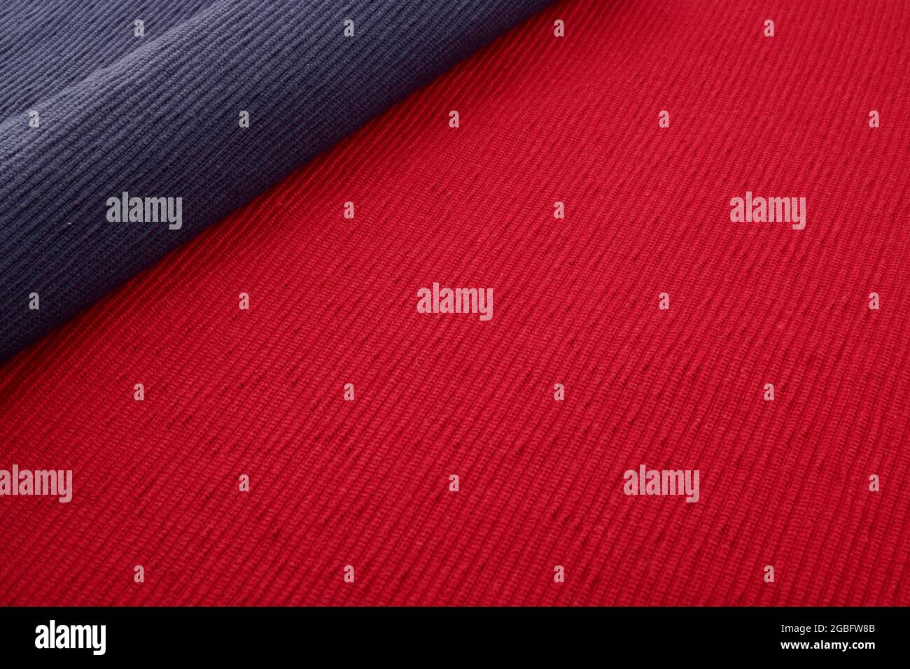 blue place mat on red place mat background, table cloth Stock Photo