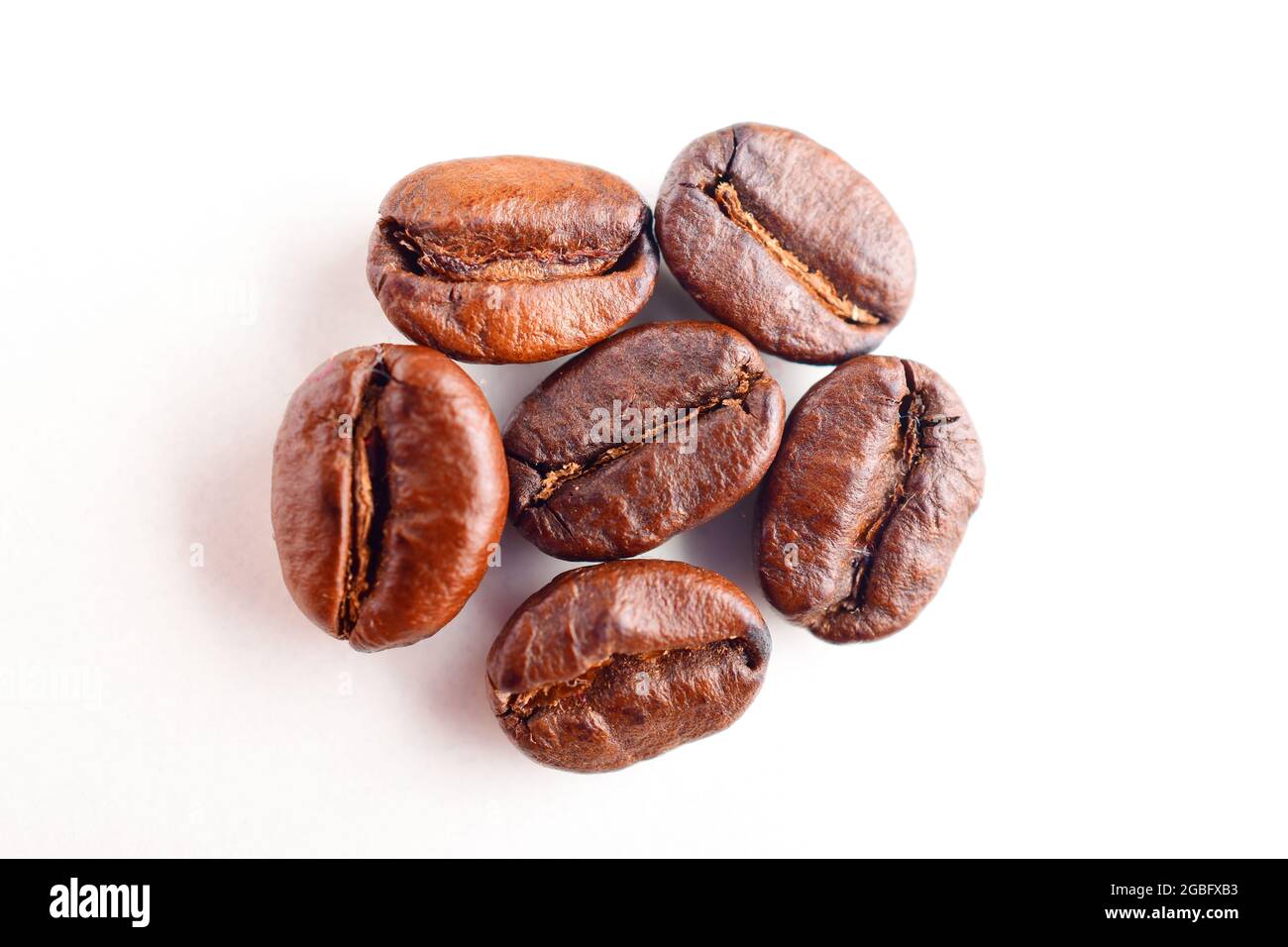 Top View Of Roasted Coffee Beans On White Background Stock Photo - Alamy