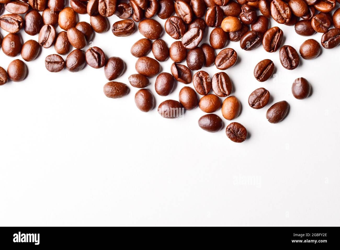 Coffee Beans On White Background With Text Space Stock Photo - Alamy