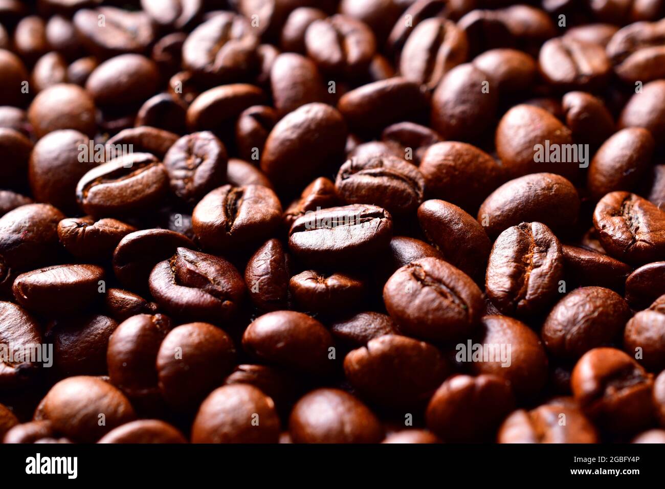 Roasted brown coffee beans pattern, background, texture Stock Photo