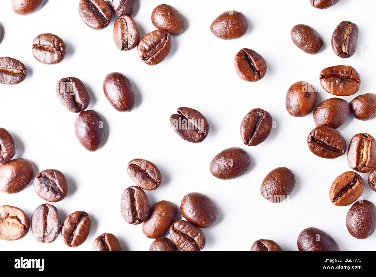 Top View Of Roasted Coffee Beans On White Background Stock Photo - Alamy