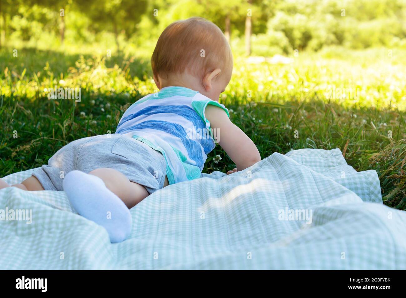 Little boy lying on grass hires stock photography and images Alamy