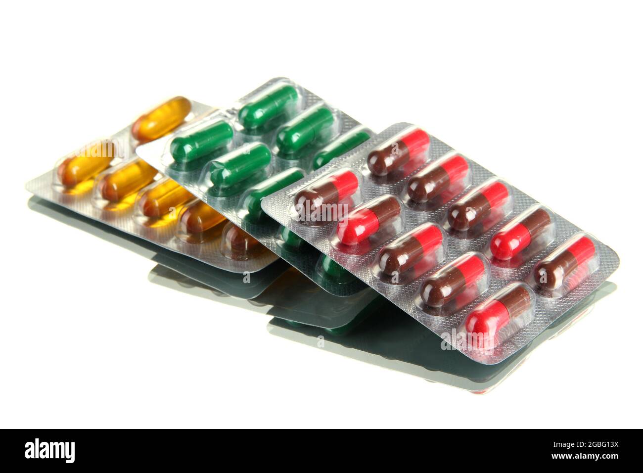 Capsules packed in blisters, isolated on white Stock Photo - Alamy