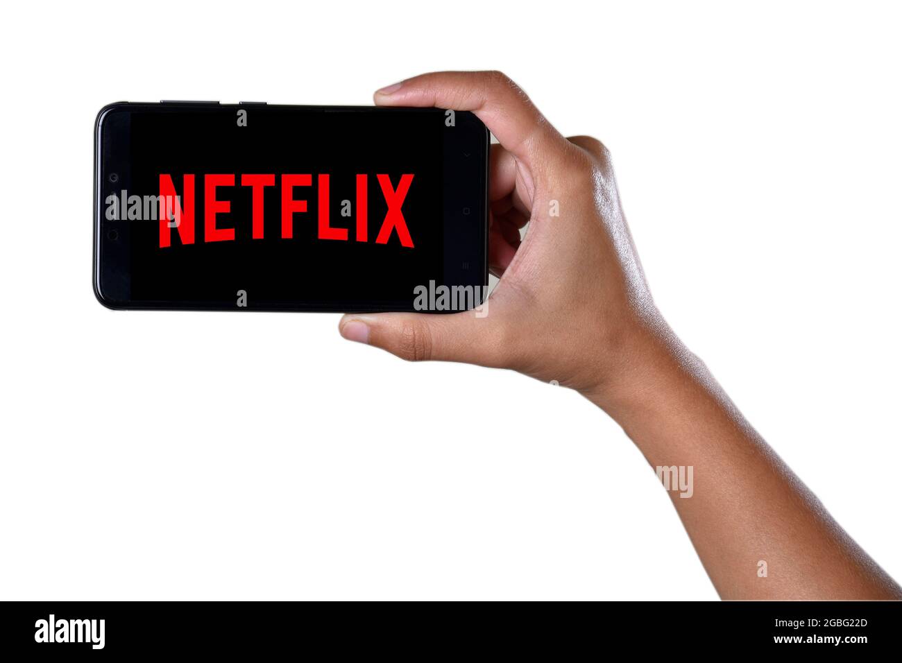 Mumbai , Indian- December 1 2018: Hand Holding Smartphone Showing Netflix Application Logo Isolated On White Background Stock Photo