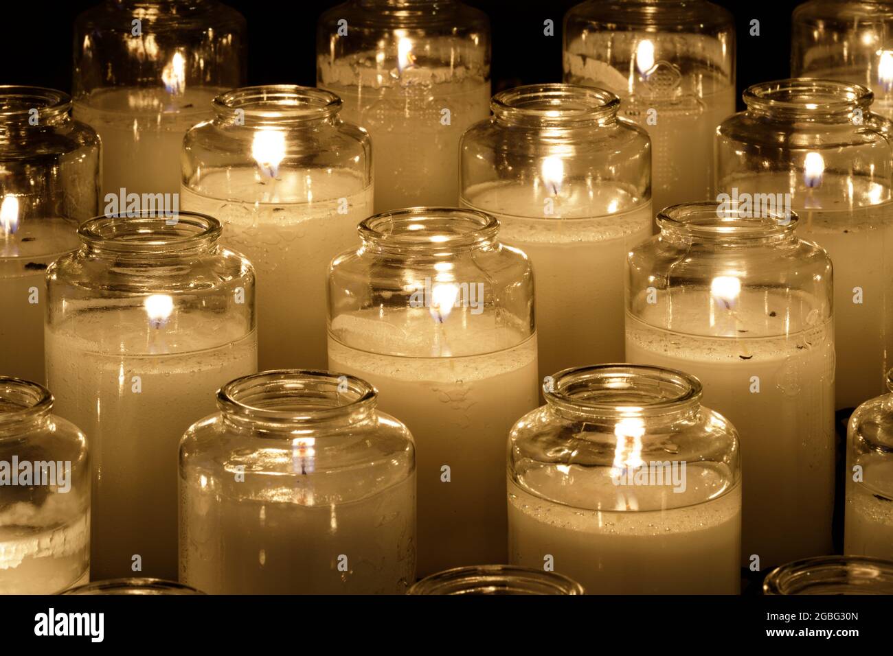 Prayer candles burning inside a church in Northern California Stock